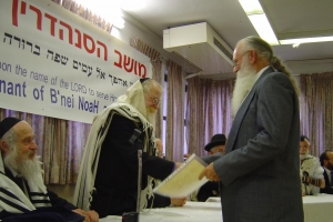 Jack Saunders, right, pledges to keep the seven Noahide laws at a 2006 ceremony in Israel presided over by Rabbi Adin Steinsaltz. (Courtesy of Jack Saunders)